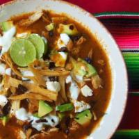 Sopa Azteca · tortilla soup served with chile guajillo, avocado, sour cream and cotija cheese