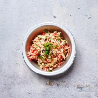 Spicy Crab Salad · Shredded Japanese kani gently tossed with scallions, pickled cucumbers and sriracha aioli ga...