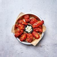 Korean Hot Spicy Wings · 10 pieces of Bell and Evans wings fried in our special olive oil blend and painted with our ...