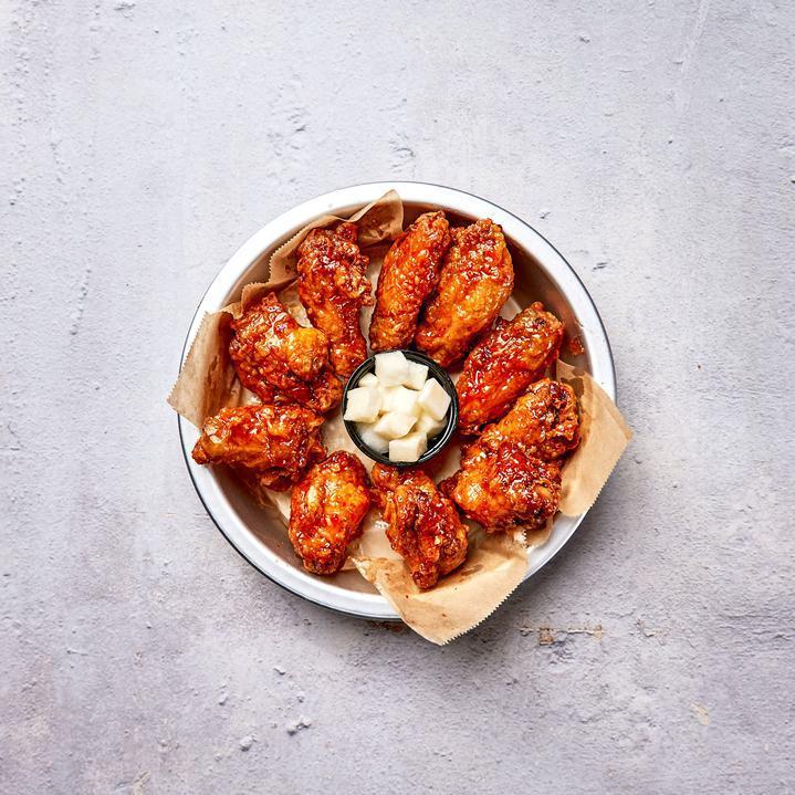 Sweet Thai Chili Wings · 10 pieces of Bell and Evans wings fried in our special blend and painted with our sweet Thai chili glaze. UNAVAILABLE Served with pickled radish.