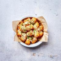 Parmesan Truffle Tots · Crispy tater tots with freshly grated Parmesan cheese, white truffle oil, and chives