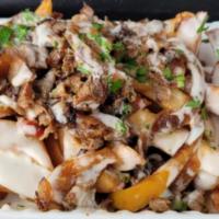Philly Cheesesteak Fries · Hand-cut fries topped with house-made cheese sauce, griddled bell peppers & onions, Philly c...