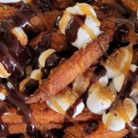 Sweet Potato S'mores Special · Cinnamon sugar tossed sweet potato fries topped with roasted marshmallows and drizzled with ...