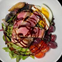 Tuna Nicoise · Roasted baby potatoes, grape tomatoes, boiled eggs, olives, and balsamic reduction.