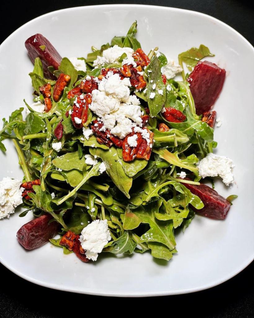 Arugula Salad · Beets, goat cheese, pecans, and balsamic vinaigrette.