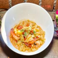 Fettucine · Shrimp, grape tomatoes, and white wine sauce.
