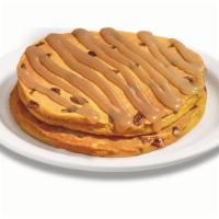 Stack of Pumpkin Pecan Pancakes · Pumpkin pancakes made with real pumpkin and cooked with pecans, then drizzled with a pecan p...
