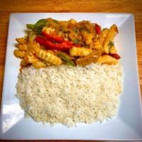 Lomo saltado  · W/ Green and Red bell peppers and French Fries 
