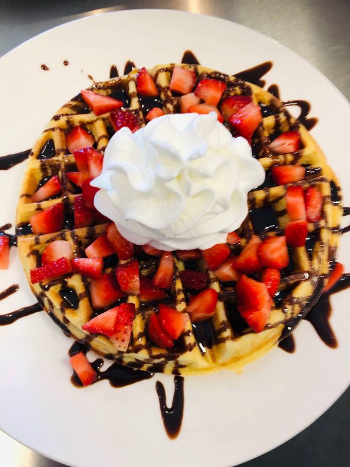 5. Chocolate Waffle · Strawberries, chocolate syrup, and whipped cream.