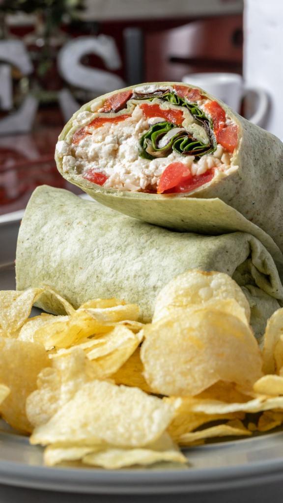 4. Vegetarian Wrap · Mixed greens, tomatoes, roasted red peppers, goat cheese, mozzarella & balsamic vinaigrette. Served with chips.