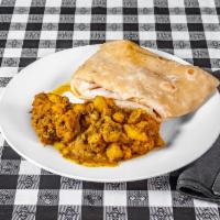Large Curry Chicken · Chicken pieces cooked in Caribbean, Indian curry spices.