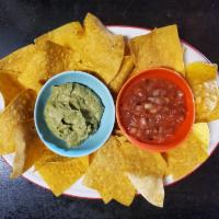 Tortilla chips w/ Salsa & Guacamole · A creamy dip made from avocado.