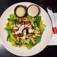 Caesar Salad · Shaved Romano ad croutons over romaine lettuce.