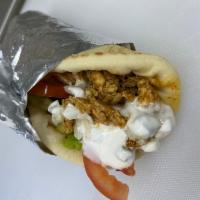 Chicken Gyro · chicken gyro, topped with lettuce, tomato, onion , tzatziki sauce and feta cheese on a pita ...
