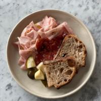 Charcuterie Plate · Pickles, mortadella, and salami with house made sesame focaccia on the side.