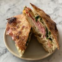 Italian Combo Sandwich · Mortadella, salami, provolone, salsa verde, and aioli, on house-made focaccia.
