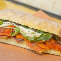 Hot Italian Sandwich · Hot Sopressata, hot capicola, pepperoni, roasted tomatoes, arugula, olive paste, pesto sauce...