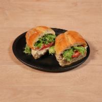Classic Tuna Sandwich · Tuna salad, lettuce, tomato and red onion on your choice of bread.