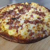 Breakfast Pizza · Mozzarella and American Cheese, Scrambled Eggs and one topping of your choice!