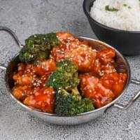 Sesame Chicken · Crispy chicken tossed in sweet sauce with sesame seed and steamed broccoli.