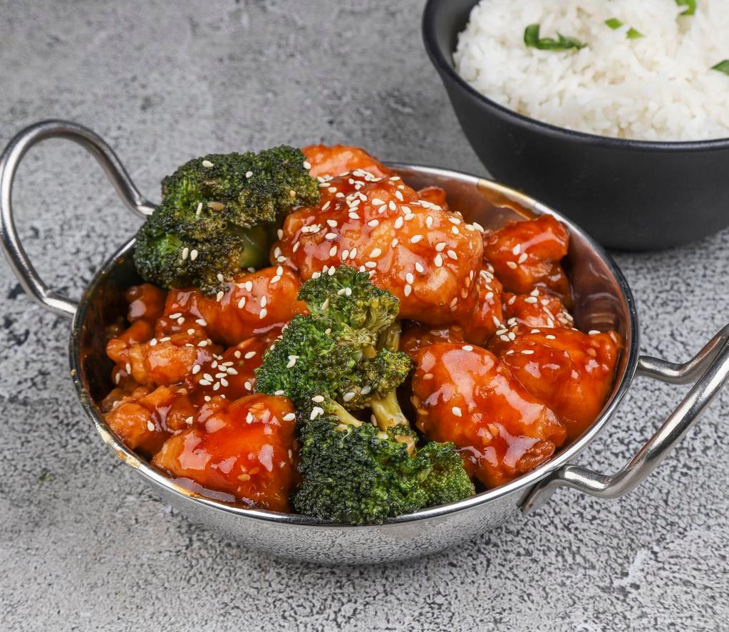 Sesame Chicken · Crispy chicken tossed in sweet sauce with sesame seed and steamed broccoli.
