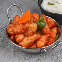 Sweet and Sour Chicken · Crispy chicken with carrots and green peppers with sauce on the side.