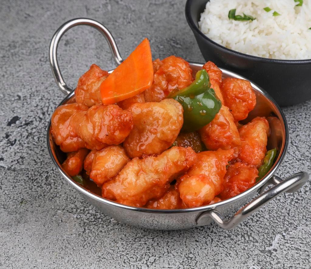 Sweet and Sour Chicken · Crispy chicken with carrots and green peppers with sauce on the side.