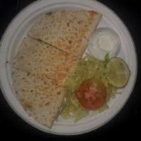 Chorizo Quesadilla · Mexican sausage.
Flour tortilla cheese and your choice of meat  sour cream lettuce and tomat...