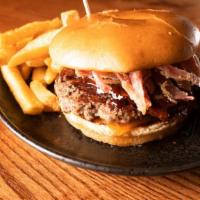 Brisket Burger  · 7 oz burger, BBQ brisket, fried pickle onions, Secret Club Sauce.