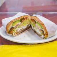 Torta · Choice of meat with lettuce, tomato, onions, avocado, jalapeno, beans and mayo.