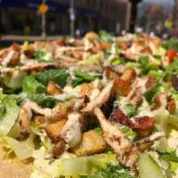 Grilled Chicken Caesar Salad Pizza · Romaine lettuce, shredded parmigiano cheese, croutons, house caesar dressing with grilled ch...