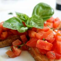 Bruschetta · Toasted bread topped with chopped tomatoes, fresh basil, extra virgin olive oil and a touch ...