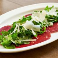 Bresaola · Imported bresaola, arugula and mixed mushrooms with extra virgin olive oil and lemon dressing.