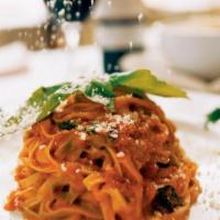 Paglia and Fieno · Homemade fettuccine with a light tomato sauce, Parmigiano, and a touch of cream. Traditional...