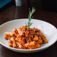 Rigatoni alla Bolognese · With the finest homemade meat sauce. Traditionally made like in Italy, al dente.