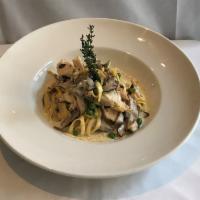Tagliolini di Cortina al Pollo · Chopped chicken breast, peas, mushrooms and a touch of cream. Traditionally made like in Ita...