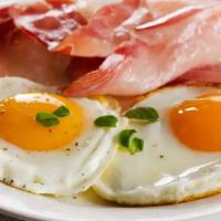 2 Eggs with Bacon · Fresh cooked eggs mixed with bacon strips on choice of bread.