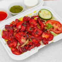 Spiced Glazed Chicken Tikka with Rice · Comes with basmati rice, salad and sauce.
