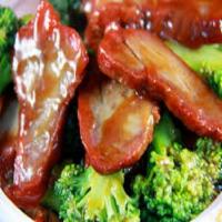 27. Roast Pork with Broccoli · Served with white rice.