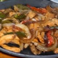 Classic Fajitas · Served on a hot sizzling cast iron skillet with peppers and onions. Served with flour soft t...