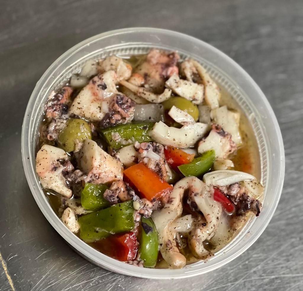 Octopus Salad · Octopus, Green Peppers, Red Peppers,Olives, White Onions,In a Fresh Lime Juice and Olive Oil Marinade.