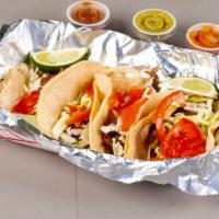Nororious Street  Tacos · Fresh corn tortillas with cabbage, spicy onions, salsa, avocado salsa and your choice of meat.