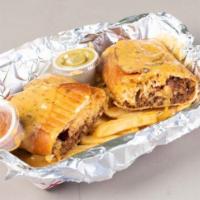 Sky's the Limit Chimi · Burrito with rice and beans and your choice of meat, deep fried and smothered in queso.