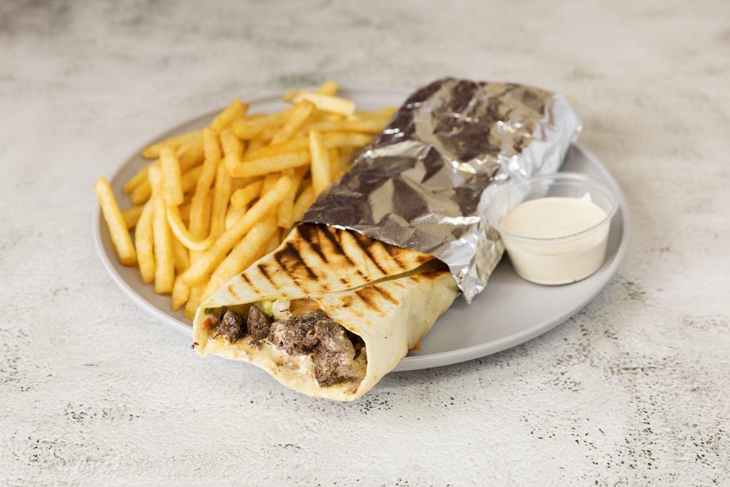 Beef Shawarma · Freshly cooked shredded beef marinated in iburger sauce, lettuce, tomatoes, onions, pickles, and tahini sauce.	
