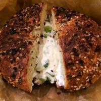 Bagel with Scallion Cream Cheese · Boiled and baked round bread roll.