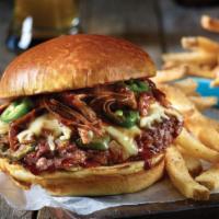 7. Deluxe Texan Burger · Beef burger with BBQ sauce, bacon and pepper jack cheese. Come with fries. Either french fri...