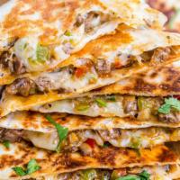 Steak Quesadilla · Served with grilled peppers, grilled onions, cheddar cheese, Jack cheese, salsa and sour cre...
