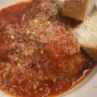 Meatballs · Three beef meatballs served with tomato sauce, and shaved Parmagiano Reggiano.