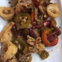 Fried Calamari · Sun dried tomatoes, olives, peppers in a spicy honey glaze.