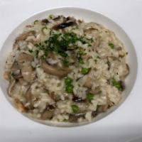 Mushroom Risotto · Wild mushrooms, peas and aged Parmesan & Truffle Oil